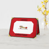 赤いバロン航空機がクリスマスカードに乗る カード (黄色い花)