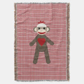赤いパターンのソックスの猿によって編まれる毛布 スローブランケット (正面縦)