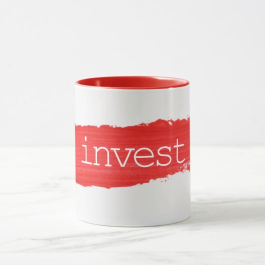 赤いペンキのマグカップにINVESTの文字 マグカップ (中央)