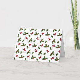 赤いリボンとクリスマスホーリーの植物の模様とテキスト シーズンカード