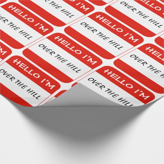 赤い名札のギフトの紙、こんにちは私は丘にあります ラッピングペーパー (角)