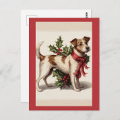 赤い弓とホリーを持つヴィンテージクリスマスドッグ ポストカード (正面/裏面)