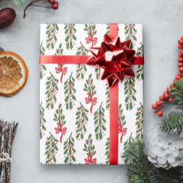 赤い弓のクリスマスと緑のホリーガーランド ラッピングペーパー