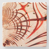 赤い曲線状のトレースを交差させ、エージングエフェクトを適用 ストーンコースター (正面)