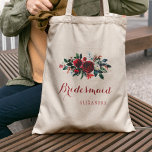 赤い牡丹の花束の冬の結婚式の花嫁 トートバッグ<br><div class="desc">パイン素朴エレガントスの緑の結婚葉、赤い果実と葉と季節の松の葉の枝を持つ水色の赤いブルゴーニュと白い牡丹の冬の花束を特徴とするフローラのメイド・オブ・オーナー(花嫁付き添い人)/フラワーガールのトートバッグカスタム。スポットに情報を入力し、あなたはそれカスタマイズをさらに変えるフォントとレタリングの色を選択できる。----トートバッグはシックな素朴な冬/エレガントクリスマスウェディングに適している。 – 助もしけが必要だ連絡よ!</div>