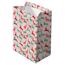 赤い緑のクリスマストナカイ模様ピンク ミディアムペーパーバッグ