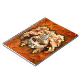 赤い背景にオレンジ色のプラムが付いたベネチアンマスク ノートブック (左側)