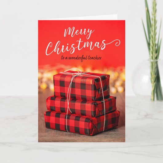 赤い背景にギフトの山 メリークリスマス教師 シーズンカード (正面)