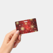 赤い背景にクリスマスのゴールドの雪の結晶 バッジ (手持ち)