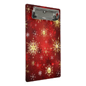 赤い背景にクリスマスゴールデンの雪片 ミニクリップボード (アングル)