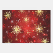 赤い背景にクリスマスゴールデンの雪片 ラッピングペーパーシート (正面2)