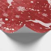赤い背景にトナカイと雪片 ラッピングペーパー (角)