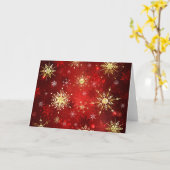赤い背景に金のクリスマスの雪の結晶 カード (黄色い花)