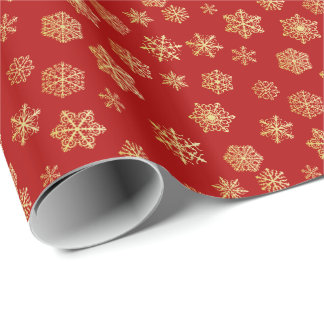 赤い背景に金色の雪が積もっている ラッピングペーパー