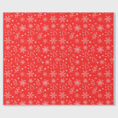赤い背景に雪の結晶、星、植物の模様 ラッピングペーパー (フラット)