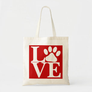 赤い背景にWhite LOVE Wordの犬の足跡パターン トートバッグ