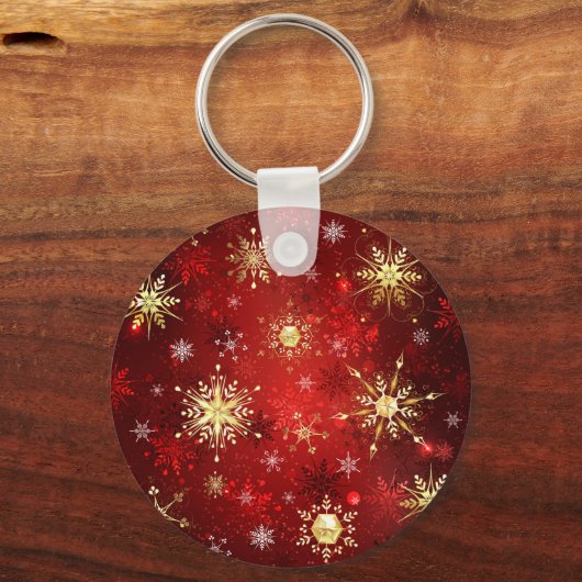 赤い背景のクリスマスゴールデンスノーフレーク キーホルダー (正面)