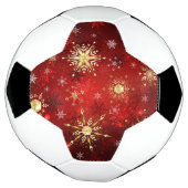 赤い背景のクリスマスゴールデンスノーフレーク サッカーボール (回転)
