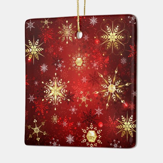 赤い背景のクリスマスゴールデンスノーフレーク セラミックオーナメント (左)
