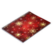 赤い背景のクリスマスゴールデンスノーフレーク ノートブック (左側)