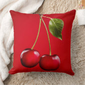 赤い背景の葉が付いているさくらんぼ クッション (ブランケット)