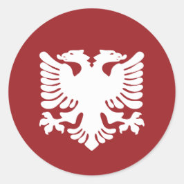 赤い背景ステッカーの白いアルバニアイーグル ラウンドシール