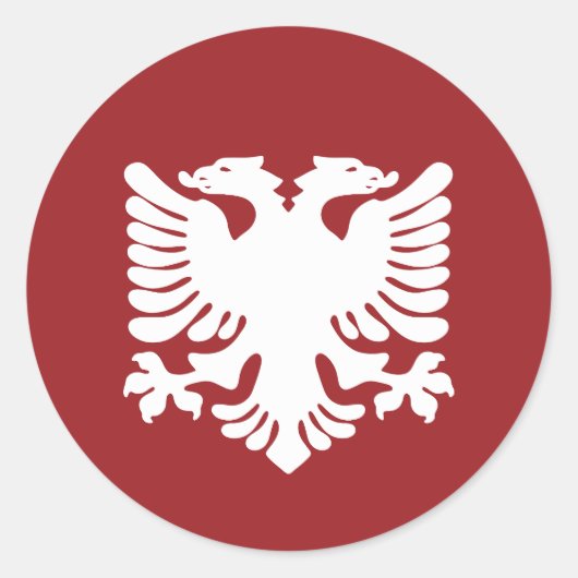 赤い背景ステッカーの白いアルバニアイーグル ラウンドシール (正面)