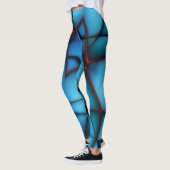 赤い部材の裂け目のある隆起した青い形のない切り出し レギンス (左)