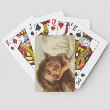 赤い髪のベッドに横たわる美しい少女