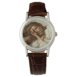 赤い髪のベッドに横たわる美しい少女 腕時計