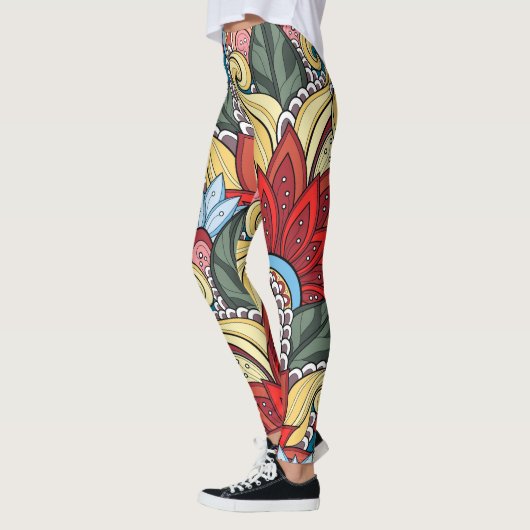 赤い黄色の青い緑の花と渦巻き レギンス (左)