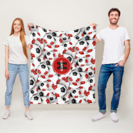 赤い黒いサッカーボールのチームカラーモノグラムの フリースブランケット