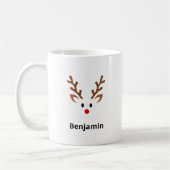 赤い鼻の名前を持つかわいいトナカイ顔 コーヒーマグカップ (左)