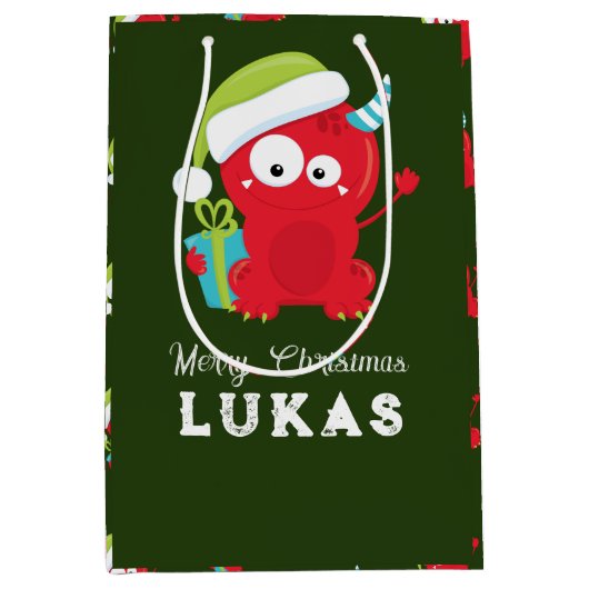 赤おもしろいクリスマスモンスターキッズホリデー ミディアムペーパーバッグ (正面)