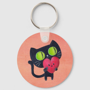 赤くかわいいハートを抱き締めているロマンチックな猫 キーホルダー