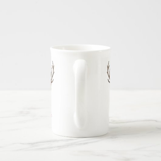 赤く及び白いポインセチアのトナカイのユニコーンを信じて下さい ボーンチャイナマグカップ (裏面)