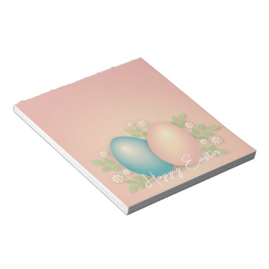 赤ちゃんブルーとピンクのイースターエッグと春フローラ ノートパッド (アングル)
