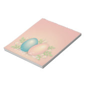 赤ちゃんブルーとピンクのイースターエッグと春フローラ ノートパッド (回転)