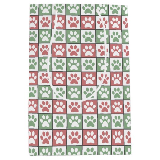 赤と緑のクリスマスをテーマにしたポーズプリントパターン ミディアムペーパーバッグ (正面)