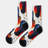 赤と青の輝くスターバストクリスマス ソックス (左)