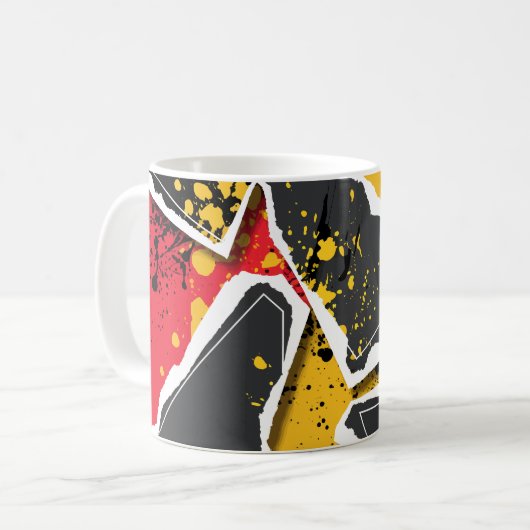 赤と黄色の背景に重なる黒い紙の破片 コーヒーマグカップ (正面左)