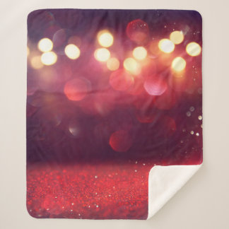 赤のグリッターヴィンテージライトの背景。デフォーカス シェルパブランケット