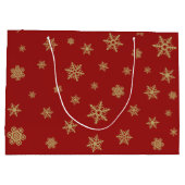 赤の雪片のデザインの金ゴールド ラージペーパーバッグ (裏面)