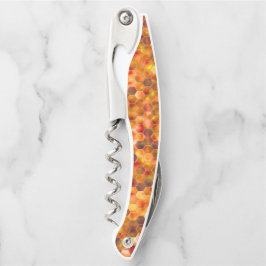 赤みを帯びたトーンのスローの点に六角形のモザイク ソムリエナイフ