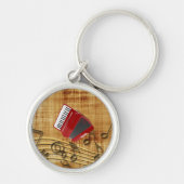 赤アコーディオン、黒いノート、金ゴールド背景キーチャ キーホルダー (正面)