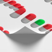 赤ユニークカプセルの中の緑の錠剤 ラッピングペーパー