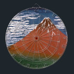 赤富士　葛飾北斎 ダーツボード<br><div class="desc">『赤富士』（あかふじ）、または『よい風、よい朝』（よいかぜ、よいあさ）は、富士山を鮮やかな朝焼けの色合いで捉えた、息をのむような木版画である。この作品は、葛飾北斎による『富嶽三十六景』のシリーズの一部で、1830年から1832年の間に制作された。 --- 木版画は、木版画（もくはんが）と呼ばれる日本語で、木のブロックにデザインを彫刻して作成されるユニークな芸術形式である。木版の浮き上がった部分にインクを塗り、紙に押し付けて画像を転写する。この技法により、太い線、はっきりとしたコントラスト、平坦な色の領域を持つプリントが作成される。 --- 北斎の『赤富士』は、この技法を巧みに利用している。雄大な富士山がシーンを支配し、その頂点は澄んだ青空に輝く純白の雪で覆われている。細い雲が青空を横切って漂い、穏やかな風をほのめかしている。プリントで最も印象的なのは、山自体が燃えるような赤で照らされ、夜明けの燃えるような余燼を想起させることである。この劇的な色彩の使用は、北斎の作品の特徴であり、シーンにほとんど神話的な品質を吹き込んでいる。 --- 富士山のふもとが、緑豊かなタペストリーのように広がり、生命に満ちた密集した森を暗示している。この緑のブランケットは、雪に覆われた頂点の厳粛な美しさと美しく対照的で、シーンに深みと立体感を加えている。ここでは、富士山の監視の下で、生態系が繁栄し、その豊かな葉は、山のふもとで繰り広げられる隠された不思議をほのめかしている。この緑のタペストリーは、『青木ヶ原樹海』（あおきがはらじゅかい）と呼ばれる伝説の森を隠しており、英語では「樹海」または「海 of Trees」と訳される。この広大な樹木は、その美しさだけでなく、民俗学でも有名である。 --- 伝説は、青木ヶ原樹海が一種の精神的なエネルギーを帯びた場所であると言い伝えられており、ある人はそれを憂鬱なものとさえ言う。民俗学は、復讐の霊（ゆうれい）が密集した木々の間でさまよっていると語っている。真実か焚き火の話かはわからないが、青木ヶ原樹海の密集した葉と、コンパスを誤作動させるような異常な磁気特性が、その神秘的な雰囲気に貢献している。</div>