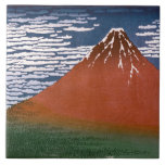 赤富士、赤富士山火山葛飾北斎 タイル<br><div class="desc">木版画日本のプリント「風澄ん朝」（別名「赤富士」「赤富士」）に描かれたシーンは、日の出の黄昏に包まれた山の富士の息を呑むような姿を見せ鮮やかる。この作品は、葛飾北斎が1830年から1832年の間に制作したシリーズ「山富士36景」の一つである。木版画プリントで日本のは、木版画(木版画)とも呼ばれる木版画型枠でユニーク、木の塊にデザインを彫ったものである。木版の盛り上がった部分をインクで塗り、紙に押し付けて画像を転写する。この技術は、ライン、スタークはっきりしたコントラスト、およびカラーの平坦な領域で知られているプリントを生み出す。 – 北斎の「赤富士」は、この技術を巧みに生かした作品だ。山威厳のあるの富士がシーンを支配し、そのピークは青い空に光る自然のままの雪で澄ん覆われた。賢い雲が青空を横切って漂い、穏やかな風にヒントを与える。プリントの最も印象的な側面は山そのもので、夜明けの燃え立つ燃え盛りを連想させる燃えるような赤い色に染み付いている。この色のドラマチックな使い方は北斎の作品の特徴であり、そのシーンを神話的なクオリティで表現している。山富士の麓は、緑のタペストリーのように広がり、森の中には生物が密集している。この緑の毛布のコントラストは、雪のキャップされたピークの厳しい美しいと美しく、シーンに深さと寸法を追加。山の富士が見守る眼差しの下に浮かぶ豊かな葉が疑問に思、山の麓に広がる隠れ家に浮かび上がる。青木ヶ原樹海(青木ヶ原樹海)という伝説の森を隠した緑のタペストリー。この広大な木々は、その美しいで有名であるだけでなく、民俗的にも包まれている。- – 青木ヶ原樹海がスピリチュアルのエネルギーに満ちた場所だという伝説的な囁き声は、哀愁を帯びたものとも言われる。密な木々の間に残る怨霊である幽霊(幽霊)の話が民俗的に伝えられている。真実の話かキャンプファイヤーの話か、故障の原因となる大木ヶ原樹海の密集した葉と異常な磁気特性は、神秘的なオーラの一因となる。-- 1830年から1832年までの葛飾北斎デートすることによる山富士シリーズの36景の一部。作家は1849年に亡くなり、この作品は原産国や他の国のパブリックドメインに属し、著作権期間が作家の生活に加えて100年以下である。</div>