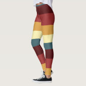 赤、ティール（緑がかった色）、黄ストライプ色 レギンス (左)