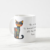 趣のある「机の上のものを落とした」顔 コーヒーマグカップ (正面左)